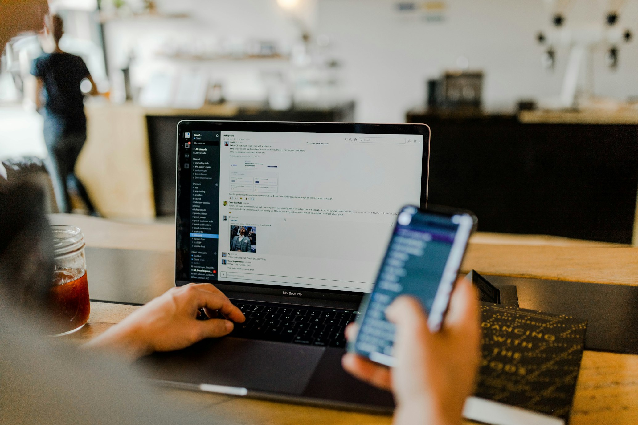 Professional working securely on laptop and phone